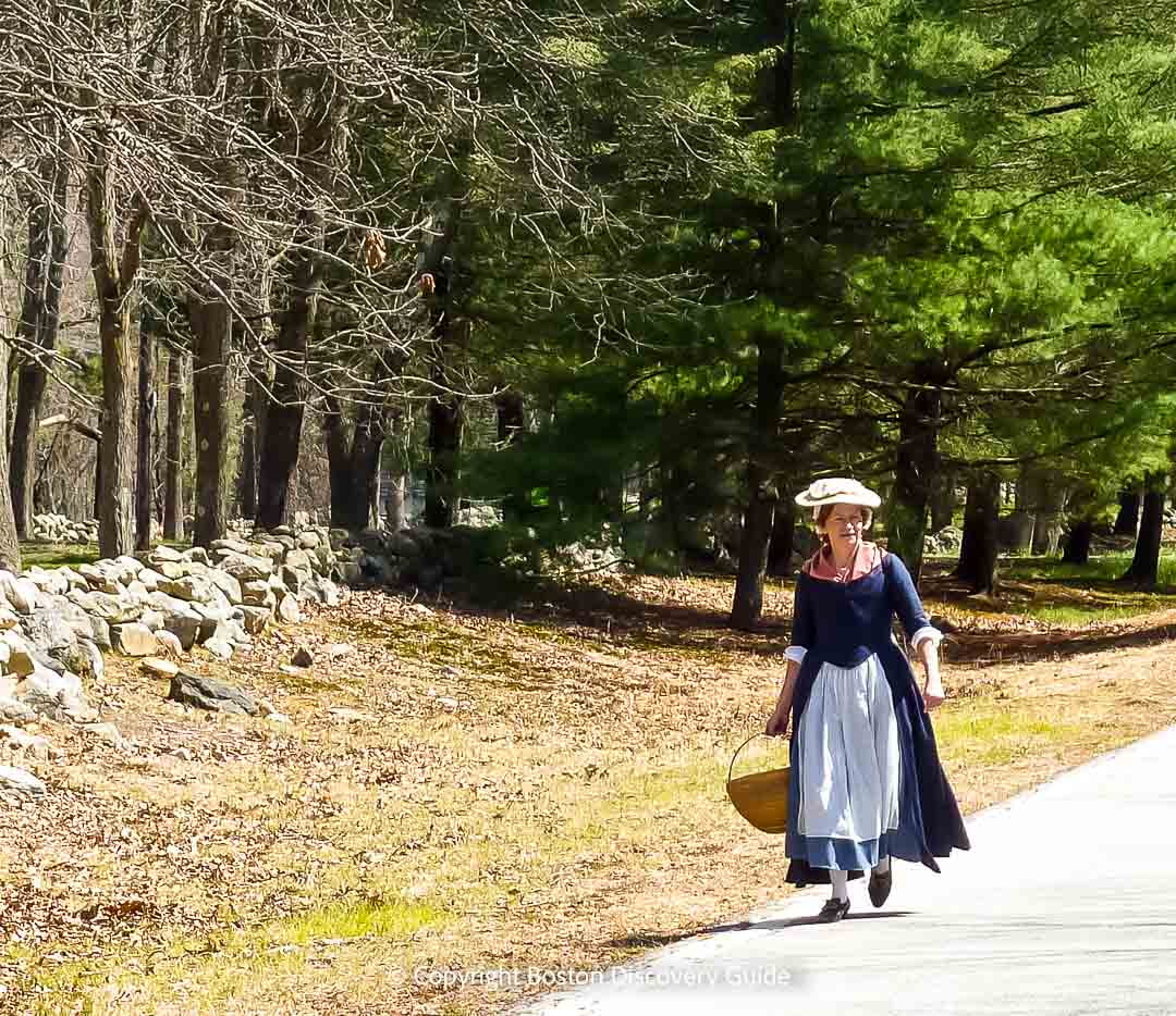 Reenactor dressed as a Colonial woman